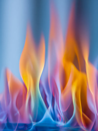 Swirling streaks of fiery colors intertwine with cool tones, forming an energetic, abstract pattern that evokes movement and harmony against a tranquil backdropの写真素材