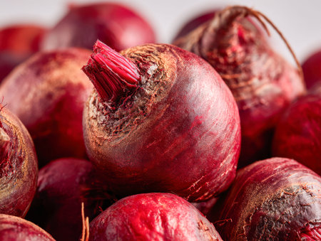 Vibrant bunch of freshly harvested beetroots with rich crimson hues and textured skin, artfully...