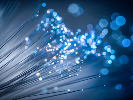 A mesmerizing web of luminous fiber strands in vibrant shades of blue and white, illustrating the...