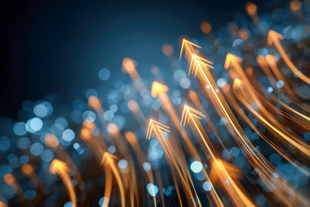 Vibrant golden streaks ascendingly energetically amid a soft blue glow, capturing a sense of innovation and momentum in a sleek, futuristic aesthetic.の写真素材