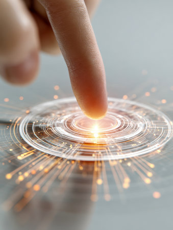 A single finger hovers over a high-tech, luminescent control panel, activating intricate glowing circuits and vibrant light patterns on a polished surface, symboliziの写真素材