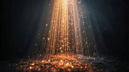 Twinkling gold flecks cascade through a shadowed realm, bathed in soft amber illumination, enhancing a dreamy, enchanting mood with shimmering bokeh in the background.の写真素材