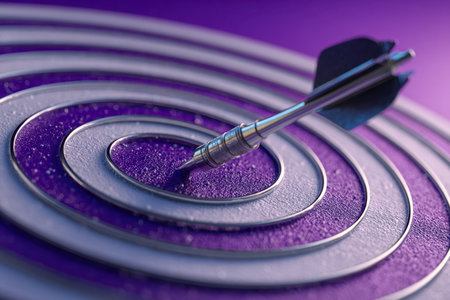 A sleek steel dart strikes the bullseye of a purple-gray layered target, capturing focus, accuracy, and the triumph of goal-setting in a dynamic environment.の写真素材
