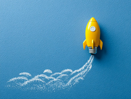 A playful yellow rocket with a light bulb base ascends against a textured blue backdrop, accompanied by chalk-drawn paths representing fresh ideas and creative energの写真素材