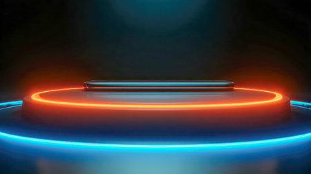 A high-tech display features a slim smartphone encircled by luminous orange and blue rings, set against a minimalistic dark backdrop with gentle ambient illuminationの写真素材