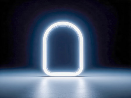 A sleek white neon arch radiates luminous energy, set against a dark backdrop. Its gentle reflection on a smooth surface, accented by a faint blue halo, creates a fuの写真素材