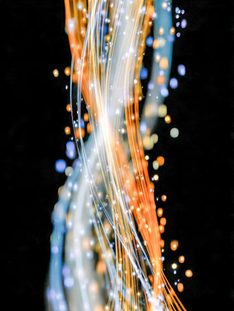 Dynamic streaks of blue, white, and orange light weave across a dark backdrop, illuminated by shimmering bokeh sparks, evoking high-energy motion and modern vibrancyの写真素材