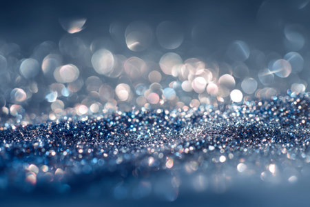 A serene cascade of shimmering blue and silver particles crafts a captivating, dreamy atmosphere with luminous reflections and gentle, out-of-focus glints enhancingの写真素材