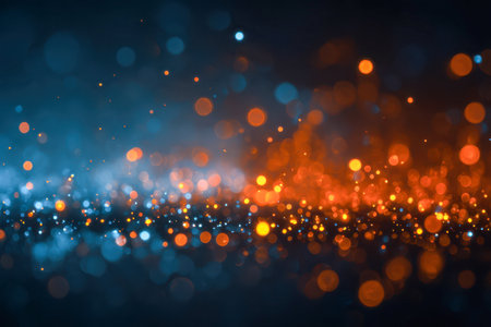 A lively display of luminous blue and orange spheres blurs into a festive mosaic, enhanced by gentle bokeh effects, perfect for captivating abstract event visuals.の写真素材