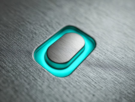 A sleek metal switch with a matte finish and vibrant turquoise glow, set against a textured background, embodying cutting-edge technology and innovative interface deの写真素材