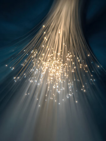 Vibrant, luminous strands intertwine, casting gentle radiance onto a shadowy, diffused backdrop, symbolizing the intricate flow of digital data and advanced connectiの写真素材