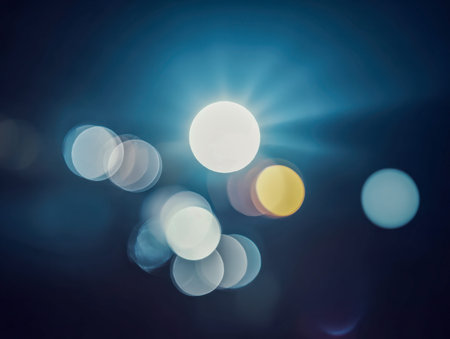 Delicate luminous spheres hover gently on a deep navy backdrop, crafting an ethereal, hazy...