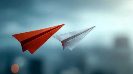 A vibrant red and a sleek white paper craft soar together in tandem, embodying innovation and...