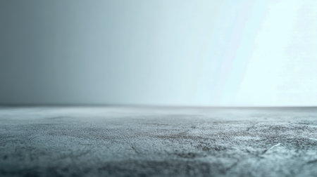 A sleek, neutral surface of rough stone tiles bathed in gentle gradient illumination, ideal for showcasing products or presenting modern architectural concepts.の写真素材