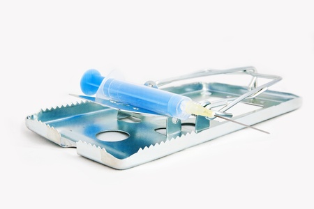 Addiction concept image of risks - mouse trap with blue syringeの写真素材