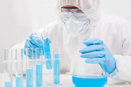 Scientist working in laboratory examiningの写真素材