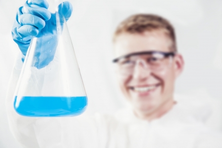 Laboratory worker offering ready experimentの写真素材