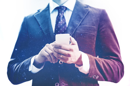 Business man using mobile device conceptの写真素材