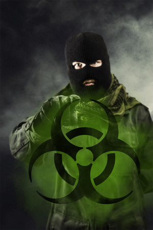 Terrorist threatening with bioterror biohazard symbolの写真素材