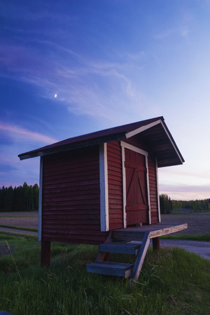 Old milk churn stand (maitolaituri) in rural countryside, Kouvola, Finlandの写真素材