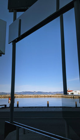 View from the terrace of a modern building on the sea and mountains