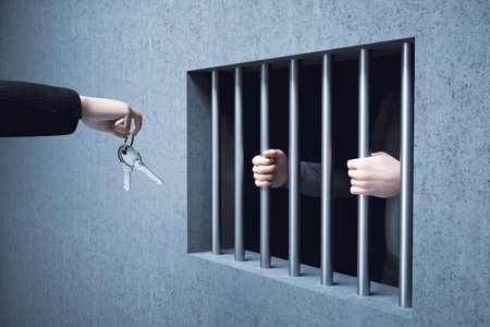 Man giving a key to prisoner. This is a 3d render illustrationの写真素材