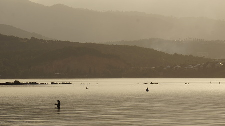 Evening fishing in shallow waters.の写真素材
