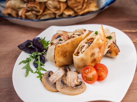 pancakes stuffed with chicken and mushroomsの写真素材