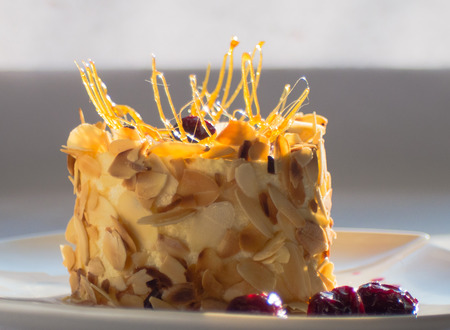 semolina pudding with cream and cherryの写真素材