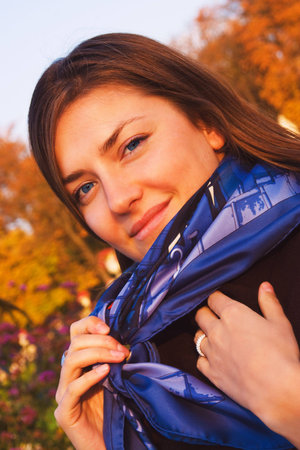 Outdoor sunset autumn portrait of a pretty girlの写真素材