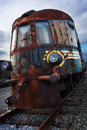 old broken rusty locomotive still on railsの写真素材
