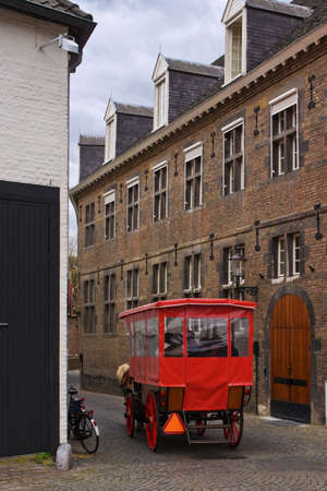 Touristic carriage riding on medieval Dutch streetの写真素材