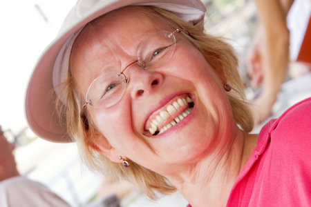 Informal head portrait of a happy mature woman 