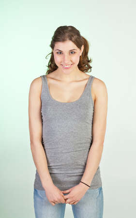 Humble smiling teenager girl in late teensの写真素材