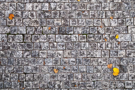 Closeup view on a cobblestone road - pattern - backgroundの写真素材