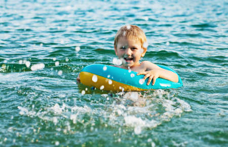 Little boy having fun in the waterの写真素材
