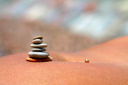 pyramid of stones on his belly close-up