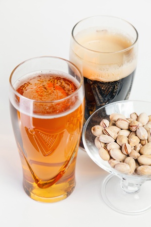 a glass of light and dark beerの写真素材