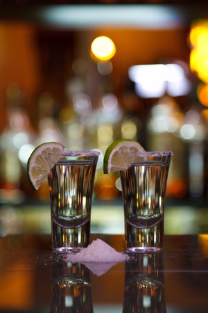 two shots of tequila with lime and saltの写真素材