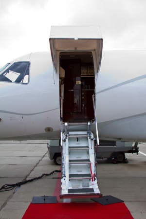 lowered ladder of a small private plane on the groundの写真素材