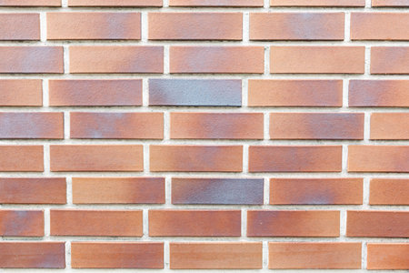 photo of section of brick wall of red color close-up
