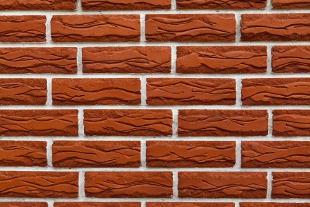 photo of section of brick wall of red color close-upの写真素材