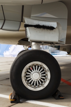 rear landing gear and jet engine passenger plane on the groundの写真素材