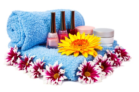 blue towel, nail polish, gerbera and chrysanthemum isolated on white backgroundの写真素材