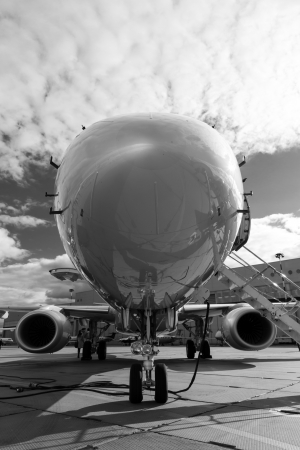 White reactive private jet, the front landing gear and a ladderの写真素材