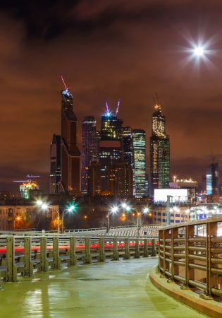 Night road and skyscrapers of Moscow against the skyの写真素材