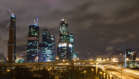 Night road and skyscrapers of Moscow against the skyの写真素材
