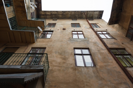 old courtyard of the city Lviv against overcast skyの写真素材