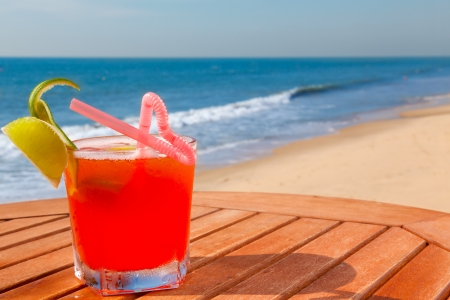 alcohol cocktail on the wooden table with crushed iceの写真素材