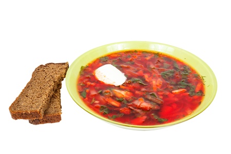 rye bread and a plate with fresh hot borsch isolated on a white backgroundの写真素材